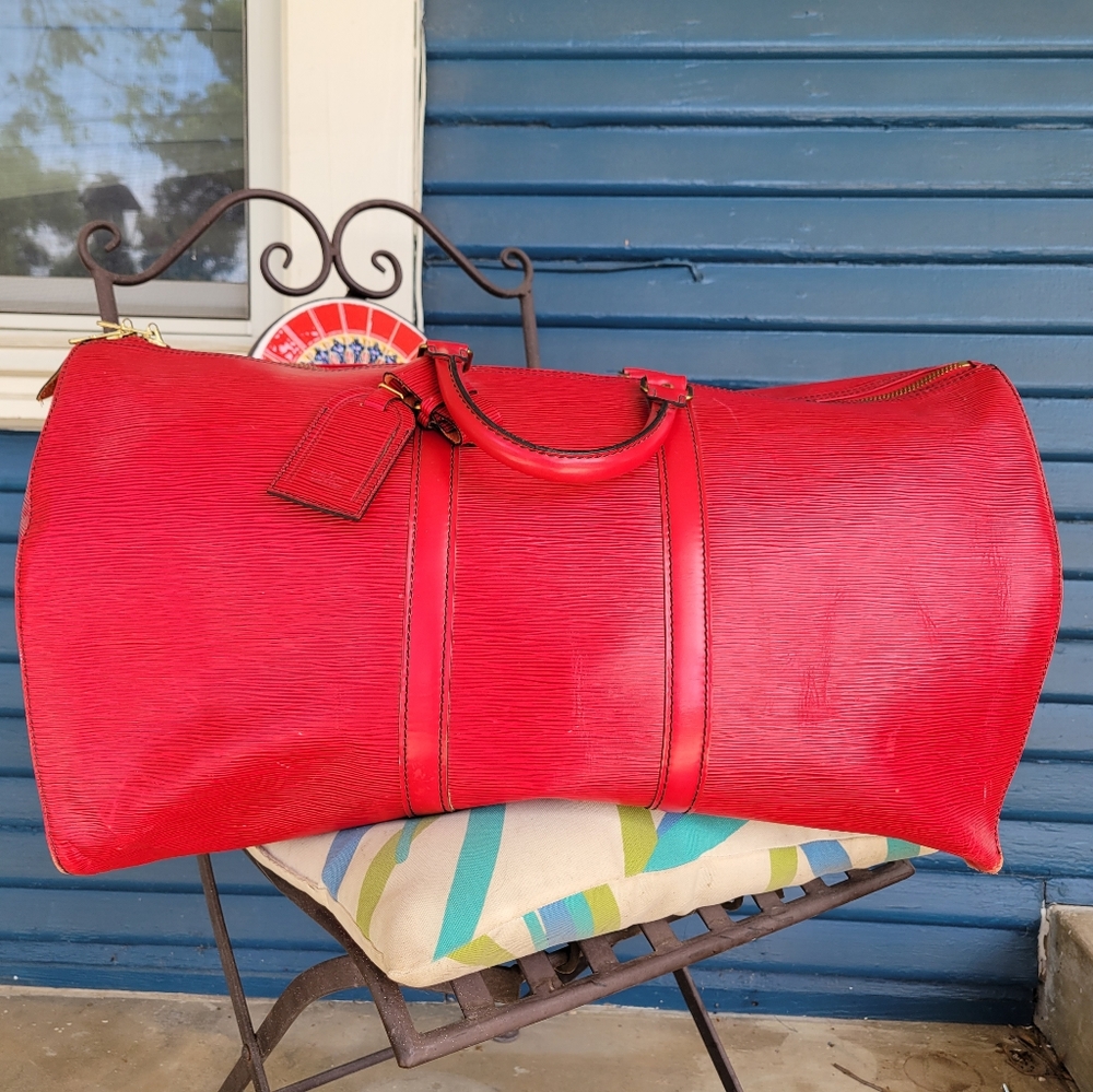 Louis Vuitton red duffle bag